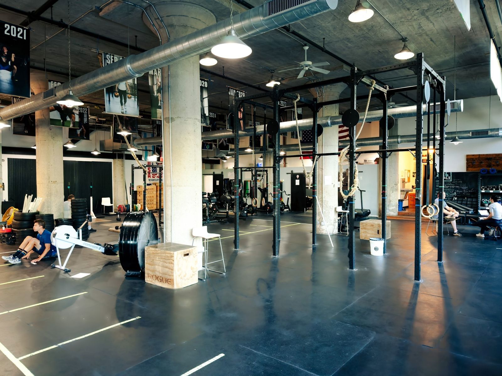 The rig area with climbing ropes, rings and open floor space for open gym